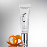 A bottle of 10% Vitamin C Self-Activating next to orange peels