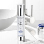 A vial of Daily Power Defense in front of a white sink