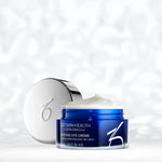 A small container of Intense Eye Crème in front of a texuted background