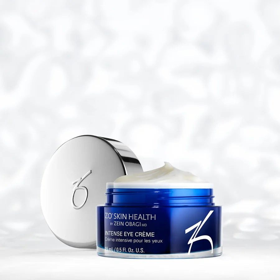 A small container of Intense Eye Crème in front of a texuted background