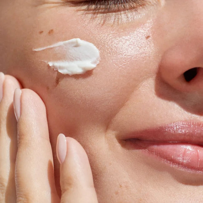 Zo Health Cream placed on a model's cheek