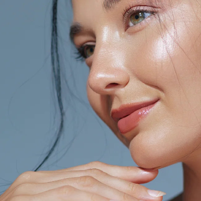 A model with glass-like skin smiling